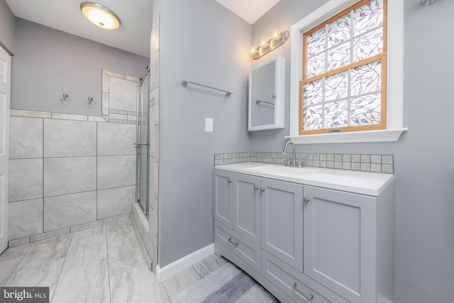 2 Stretch Dr, Mullica Hill, NJ 08062 - bathroom featuring a tile shower, vanity, and baseboards