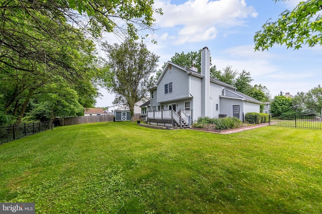 2 Stretch Dr, Mullica Hill, NJ 08062 - rear view of property featuring a chimney