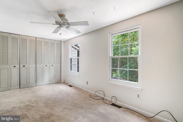 9147 Everett Ct, Springfield, VA 22152 - unfurnished bedroom featuring carpet flooring, a ceiling fan, and a closet