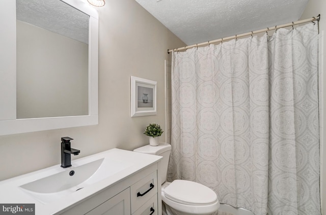 9147 Everett Ct, Springfield, VA 22152 - bathroom with a textured ceiling, vanity, and a shower with shower curtain