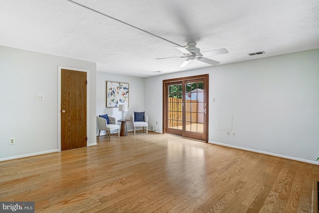 9147 Everett Ct, Springfield, VA 22152 - unfurnished room featuring light wood-style floors, ceiling fan, and a textured ceiling