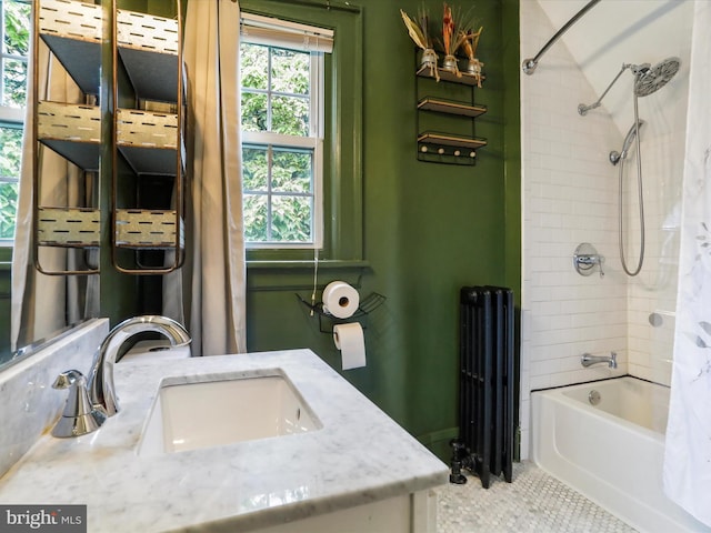 619 Lynn St, Cumberland, MD 21502 - bathroom with radiator heating unit, vanity, shower / bath combo, and tile patterned floors