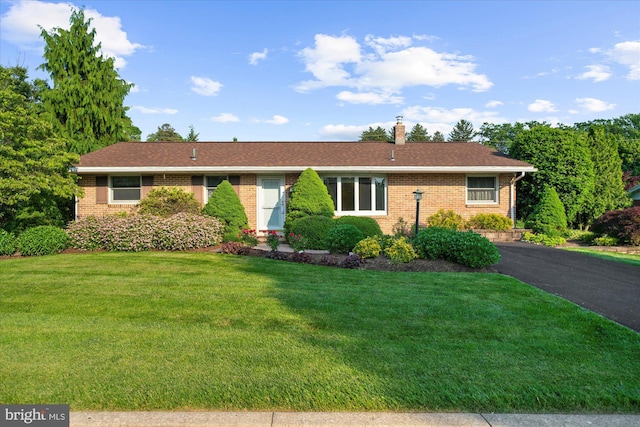 464 E Walnut St, Kutztown, PA 19530 - single story home with brick siding, a front lawn, a chimney, and driveway