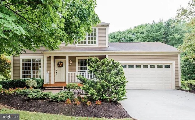 6290 Pinyon Pine Ct, Eldersburg, MD 21784 - view of front facade featuring concrete driveway, a garage, and covered porch