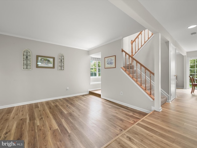 6290 Pinyon Pine Ct, Eldersburg, MD 21784 - unfurnished living room featuring wood finished floors, stairway, and crown molding