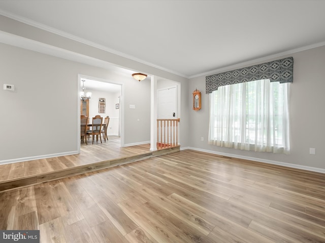6290 Pinyon Pine Ct, Eldersburg, MD 21784 - empty room with a chandelier, light wood-style floors, and ornamental molding