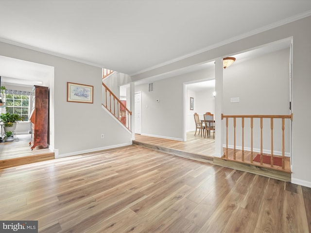 6290 Pinyon Pine Ct, Eldersburg, MD 21784 - unfurnished living room with wood finished floors, ornamental molding, and stairway