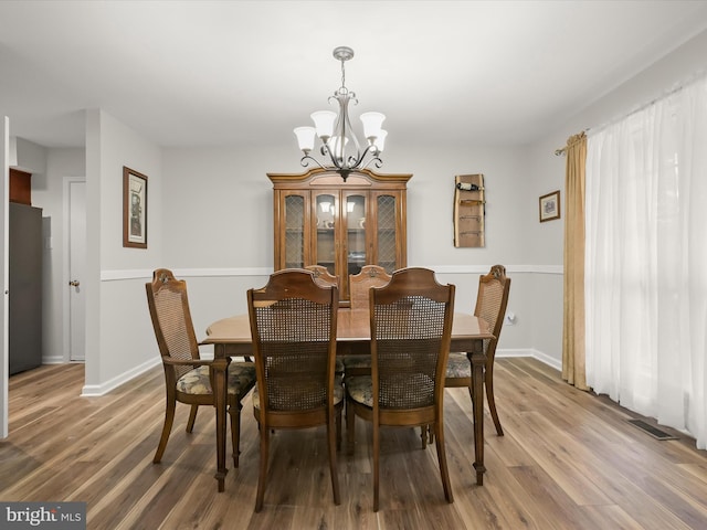 6290 Pinyon Pine Ct, Eldersburg, MD 21784 - dining space with a chandelier and light wood finished floors