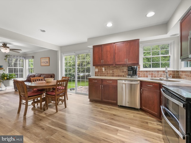 6290 Pinyon Pine Ct, Eldersburg, MD 21784 - kitchen featuring stainless steel appliances, light countertops, light wood-style floors, decorative backsplash, and recessed lighting