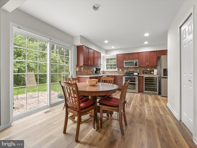 6290 Pinyon Pine Ct, Eldersburg, MD 21784 - dining area with wine cooler, light wood-style floors, and recessed lighting