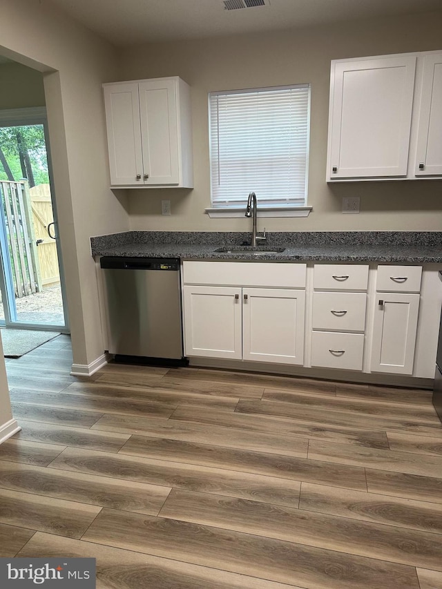4321 Drake Ct, Waldorf, MD 20603 - kitchen featuring a sink, stainless steel dishwasher, white cabinets, wood finished floors, and baseboards