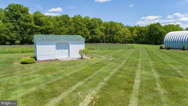 386 Marlin Savage Rd, Accident, MD 21520 - view of green lawn featuring a garage