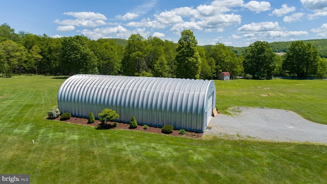 386 Marlin Savage Rd, Accident, MD 21520 - view of green lawn with an outdoor structure, an outbuilding, and a view of trees
