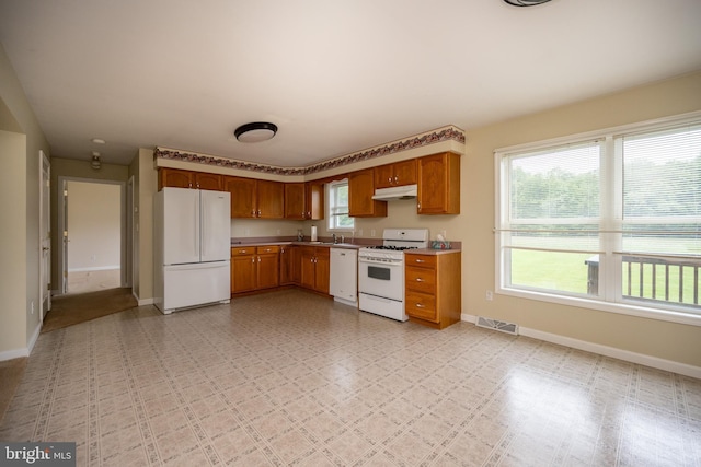 386 Marlin Savage Rd, Accident, MD 21520 - kitchen featuring white appliances, under cabinet range hood, baseboards, and healthy amount of natural light