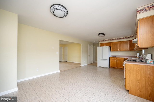 386 Marlin Savage Rd, Accident, MD 21520 - kitchen with freestanding refrigerator, light countertops, baseboards, light floors, and open floor plan