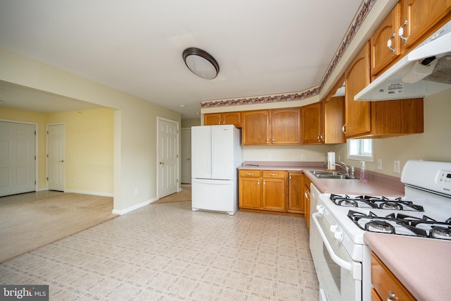 386 Marlin Savage Rd, Accident, MD 21520 - kitchen with white appliances, under cabinet range hood, a sink, light countertops, and brown cabinetry