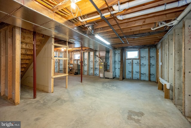 386 Marlin Savage Rd, Accident, MD 21520 - basement featuring heating unit and stairs
