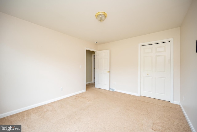 386 Marlin Savage Rd, Accident, MD 21520 - unfurnished bedroom with light carpet, baseboards, and a closet