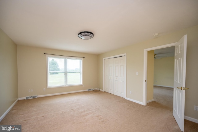 386 Marlin Savage Rd, Accident, MD 21520 - unfurnished bedroom featuring light carpet, baseboards, and a closet