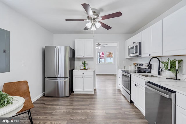 10 Taxi Way, Baltimore, MD 21220 - kitchen with stainless steel appliances, a sink, a ceiling fan, electric panel, and white cabinets