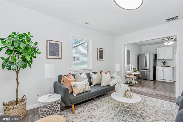 10 Taxi Way, Baltimore, MD 21220 - living room featuring wood finished floors, baseboards, and ceiling fan
