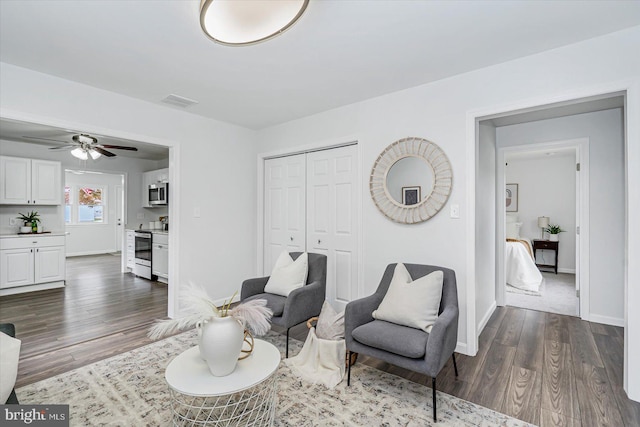 10 Taxi Way, Baltimore, MD 21220 - living room with dark wood-type flooring, baseboards, and a ceiling fan
