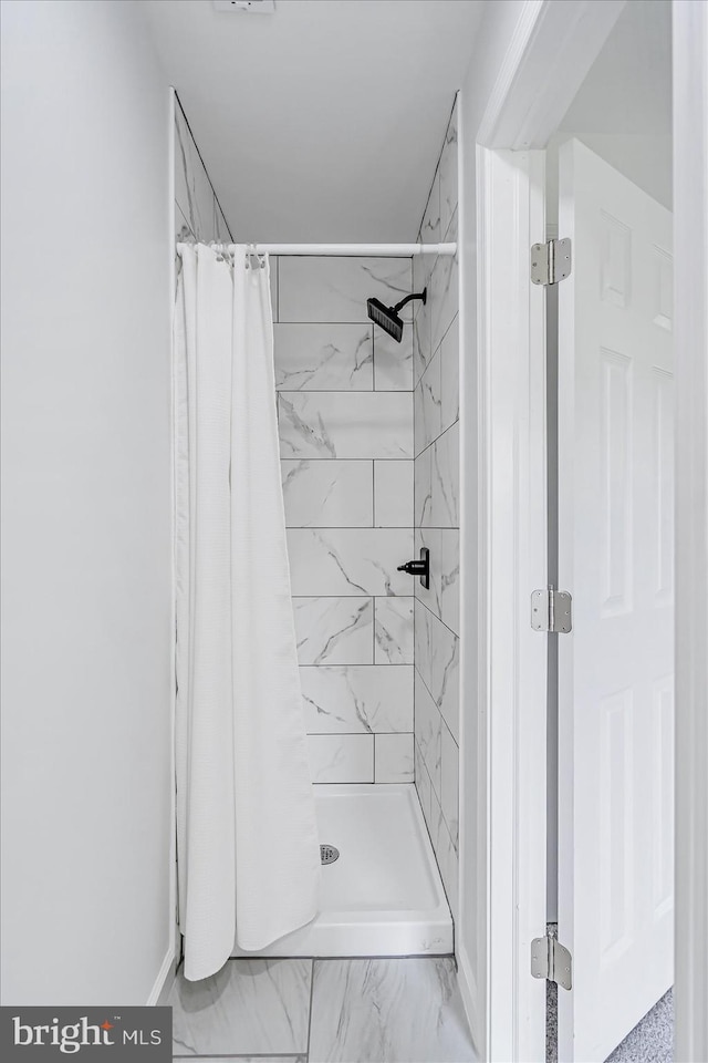 10 Taxi Way, Baltimore, MD 21220 - bathroom featuring a stall shower, marble finish floors, and baseboards