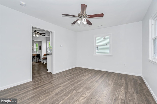 10 Taxi Way, Baltimore, MD 21220 - unfurnished room featuring plenty of natural light, wood finished floors, a smoke detector, and baseboards