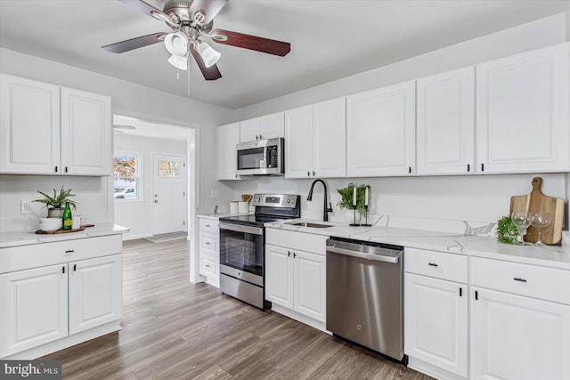 10 Taxi Way, Baltimore, MD 21220 - kitchen featuring stainless steel appliances, a sink, ceiling fan, and white cabinets