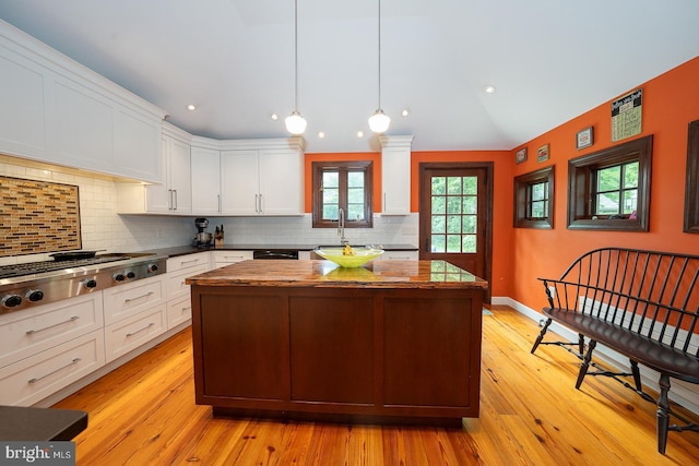 8317 High School Rd, Elkins Park, PA 19027 - kitchen featuring stainless steel gas stovetop, a center island, white cabinets, recessed lighting, and vaulted ceiling