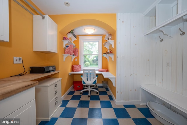 8317 High School Rd, Elkins Park, PA 19027 - office area with built in desk, light floors, and arched walkways