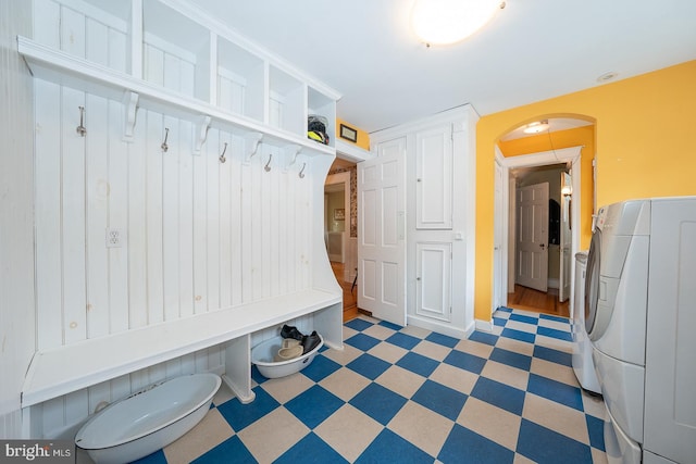 8317 High School Rd, Elkins Park, PA 19027 - mudroom with tile patterned floors, washer / dryer, and arched walkways