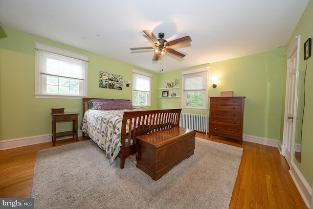 8317 High School Rd, Elkins Park, PA 19027 - bedroom with radiator heating unit, wood finished floors, and a ceiling fan