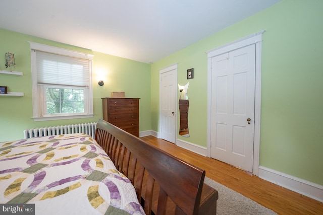 8317 High School Rd, Elkins Park, PA 19027 - bedroom with radiator and wood finished floors