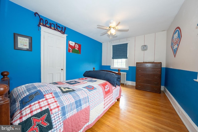 8317 High School Rd, Elkins Park, PA 19027 - bedroom with radiator heating unit, wood finished floors, and ceiling fan