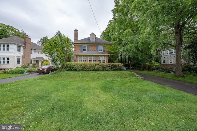 8317 High School Rd, Elkins Park, PA 19027 - view of front of home with a front yard, brick siding, and a chimney