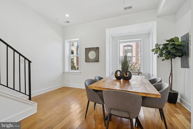 1468 Newton St NW Unit 2, Washington, DC 20010 - dining space featuring stairway, plenty of natural light, light wood-style floors, baseboards, and recessed lighting