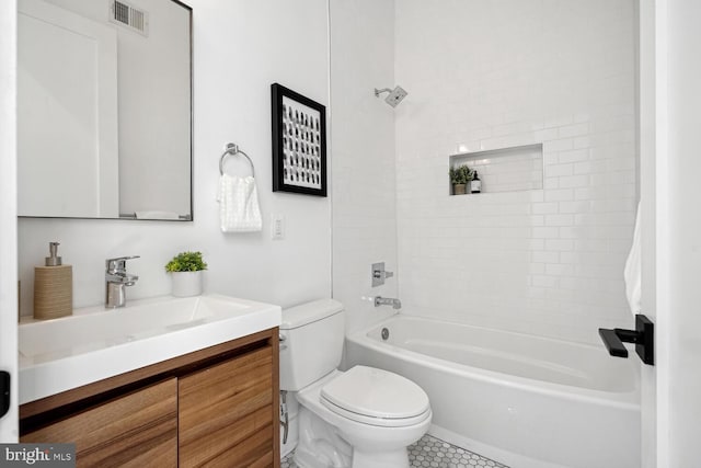 1468 Newton St NW Unit 2, Washington, DC 20010 - bathroom featuring vanity, toilet, shower / bath combination, and tile patterned floors