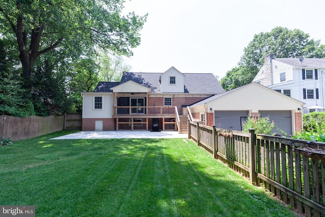 204 W Irvin Ave W, Hagerstown, MD 21742 - rear view of house with brick siding, a garage, a fenced backyard, a patio area, and stairway