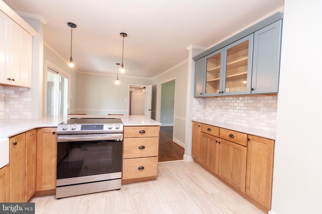 204 W Irvin Ave W, Hagerstown, MD 21742 - kitchen featuring electric stove, ornamental molding, a peninsula, light countertops, and glass insert cabinets