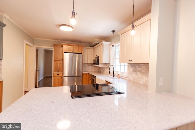 204 W Irvin Ave W, Hagerstown, MD 21742 - kitchen with freestanding refrigerator, ornamental molding, a peninsula, tasteful backsplash, and hanging light fixtures