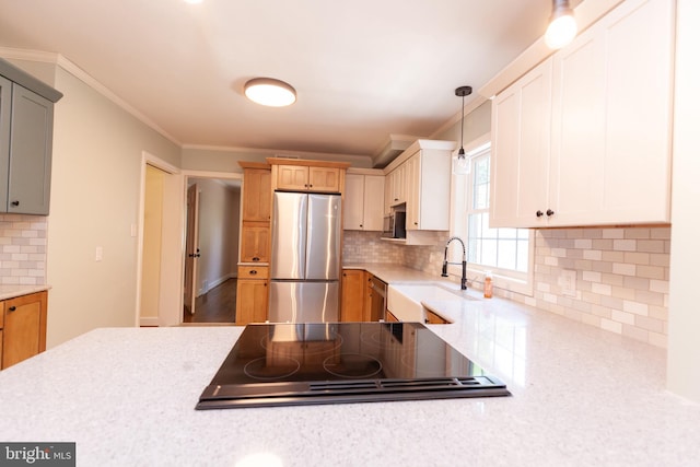 204 W Irvin Ave W, Hagerstown, MD 21742 - kitchen with appliances with stainless steel finishes, backsplash, ornamental molding, pendant lighting, and light stone counters