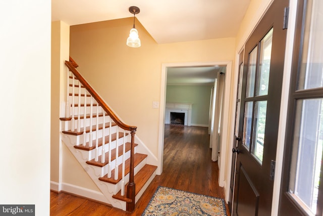 204 W Irvin Ave W, Hagerstown, MD 21742 - foyer entrance with dark wood-style floors, stairway, and a fireplace