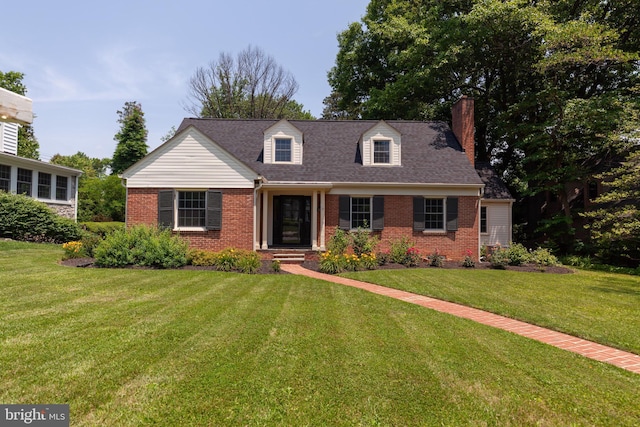 204 W Irvin Ave W, Hagerstown, MD 21742 - cape cod house with brick siding, a front yard, and a chimney