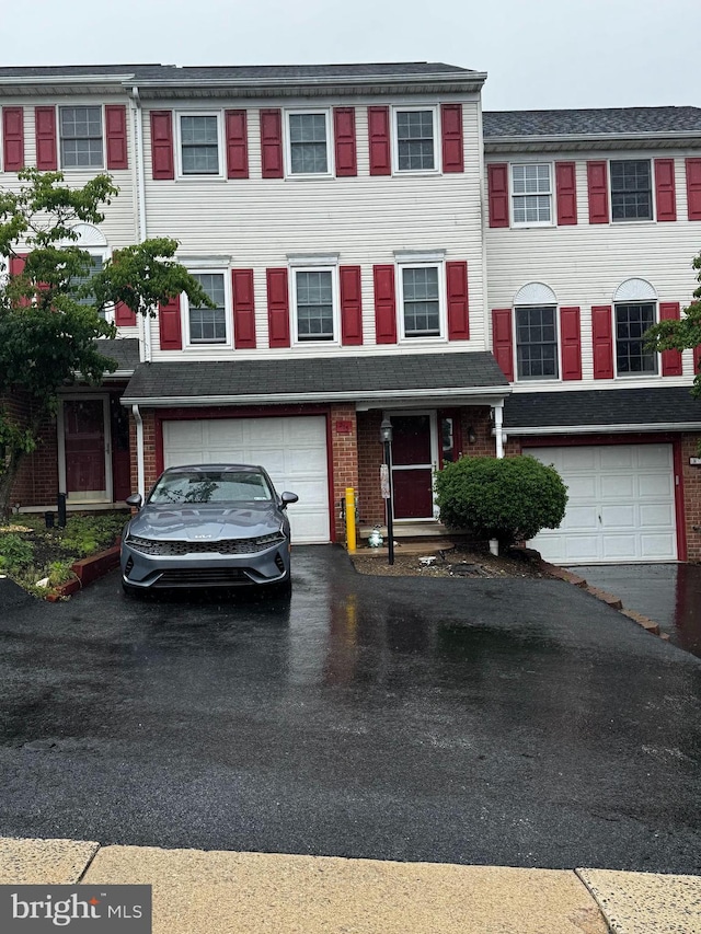 215 Robin Hill Cir, York, PA 17404 - multi unit property with an attached garage, driveway, and brick siding