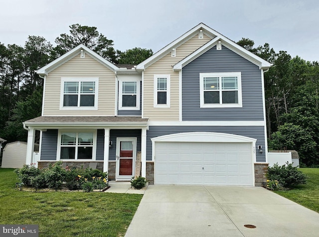 529 Birchwood Dr, Salisbury, MD 21804 - view of front of home with concrete driveway, a front lawn, stone siding, and a garage
