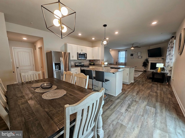 529 Birchwood Dr, Salisbury, MD 21804 - dining space with dark wood-type flooring, recessed lighting, ceiling fan, and baseboards