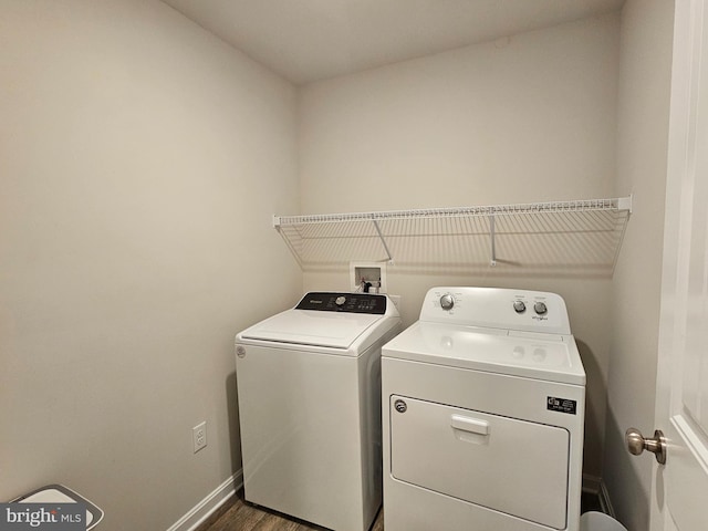 529 Birchwood Dr, Salisbury, MD 21804 - washroom with washer and dryer, baseboards, and dark wood-style flooring
