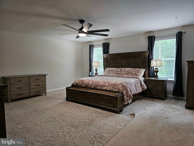 529 Birchwood Dr, Salisbury, MD 21804 - bedroom with light carpet, multiple windows, ceiling fan, and baseboards