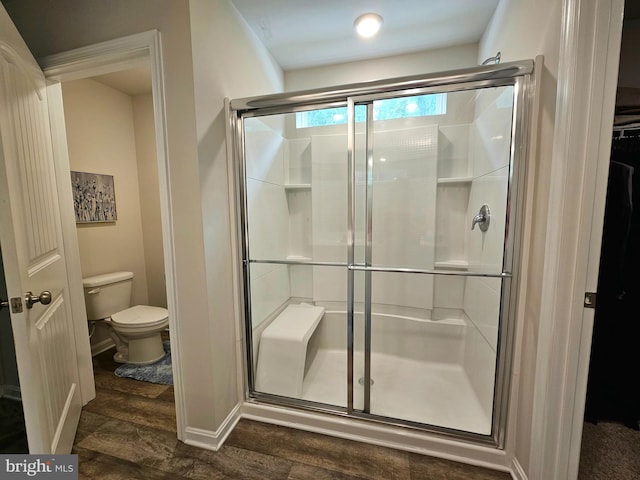 529 Birchwood Dr, Salisbury, MD 21804 - bathroom with toilet, a shower stall, wood finished floors, and baseboards